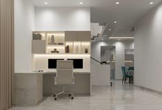 an office with white walls and flooring has a desk, chair, and shelves on the wall
