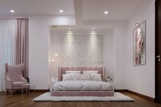 a bedroom with white walls and wood flooring has a pink bed in the middle