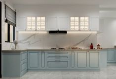 Victorian essence is all about understated grandeur. And this kitchen embraces that essence with its pastel blue and crisp white palette, effortlessly blending classic charm with modern minimalism. The Victorian-inspired shutters, delicately crafted in white, provide a beautiful contrast to the ombre blue under-counter storage, while the spacious island doubles as a practical breakfast counter. The taupe artificial marble countertop adds both sophistication and functionality, perfectly resistant to everyday stains.

This harmonious fusion of Victorian elegance and contemporary design creates a space that is as timeless as it is practical, where beauty meets purpose in every detail.
.
.
.
#ModernMinimalist #VictorianKitchen #PastelBlueInteriors Victorian Kitchen, Artificial Marble, Blue Interior, Kitchen Shelves, Marble Countertops, Kitchen Lighting, Modern Kitchen Design, Kitchen Organization, Kitchen Sink