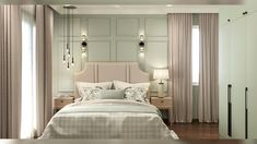 a large bed sitting under two lamps in a bedroom next to a window with curtains